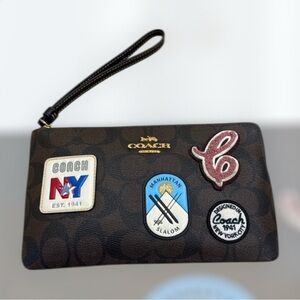 Coach large wristlet NY ski patches